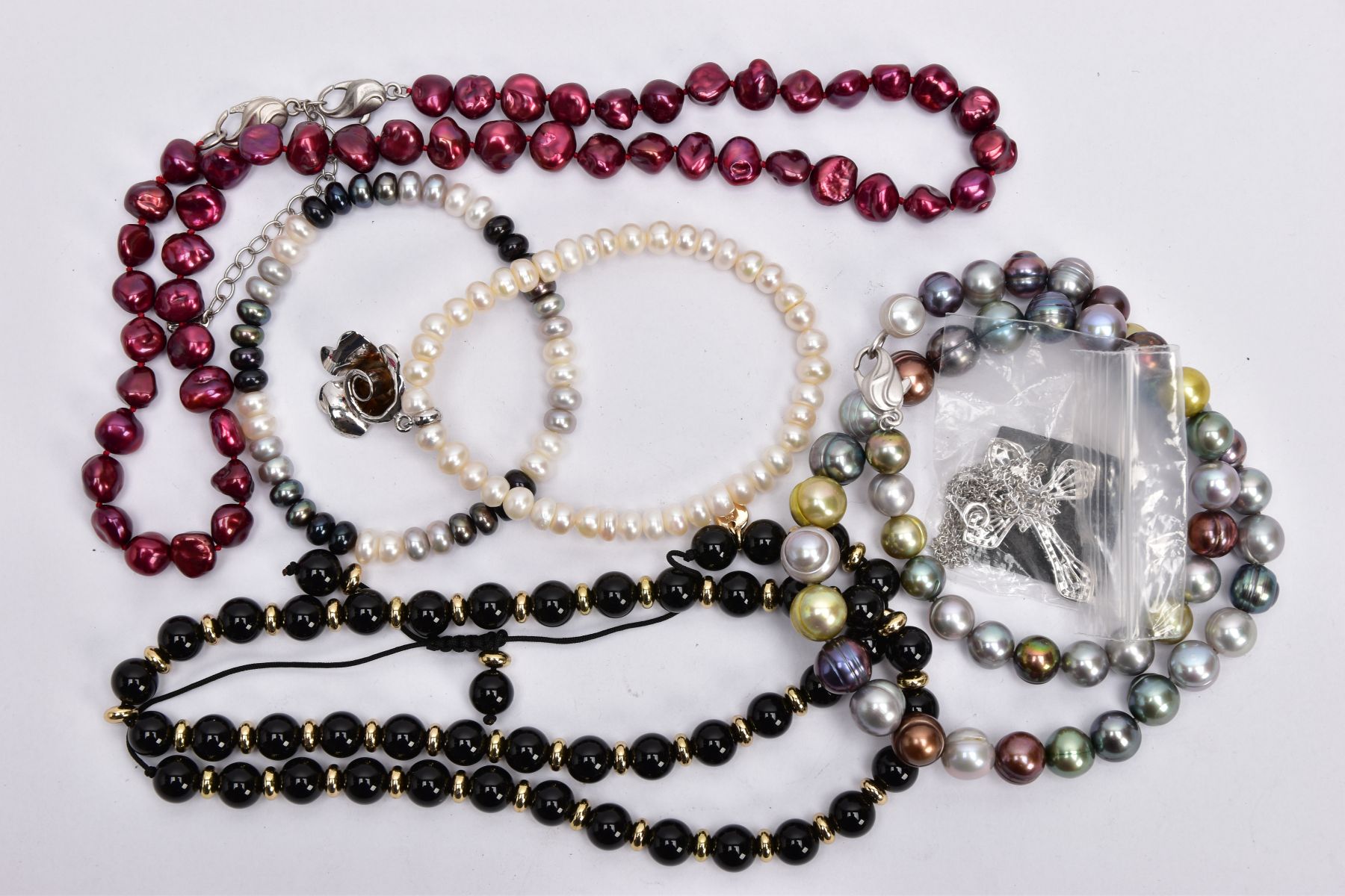 A SELECTION OF MAINLY CULTURED PEARL JEWELLERY, to include two dyed cultured pearl necklaces, two