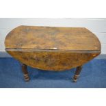 A VICTORIAN ELM CIRCULAR DROP LEAF TABLE, on fluted legs, open diameter 119cm x closed depth 64cm