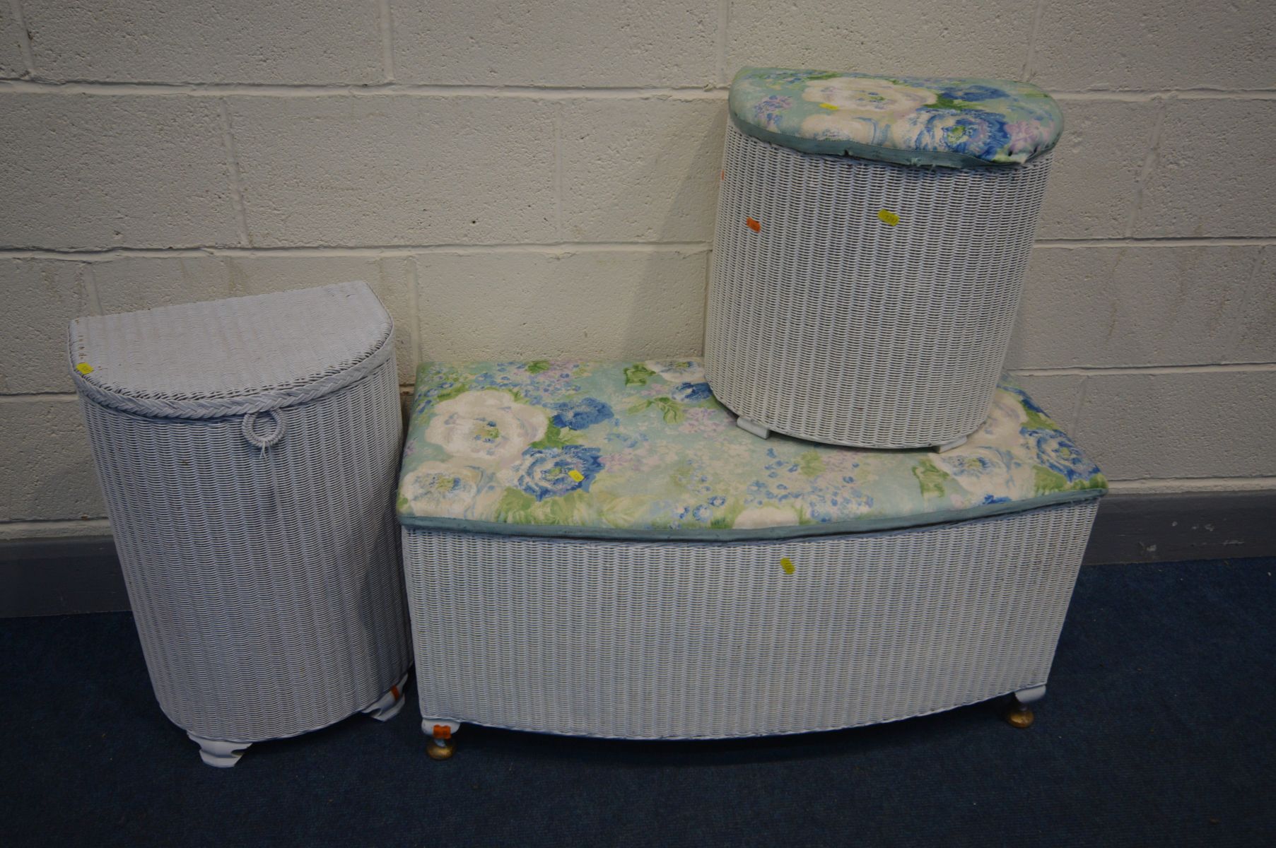 A LLOYD LOOM OTTOMAN AND TWO LINEN BASKETS (3)