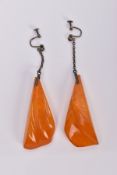 A PAIR OF NATURAL AMBER EARRINGS, the large drop earrings each of a tapered outline suspended from a