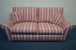 A STRIPPED PINK UPHOLSTERED BED SETTEE