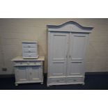 A PINE PANELLED TWO DOOR ARMOIRE, later painted white, above two drawers, width 140cm x depth 67cm x