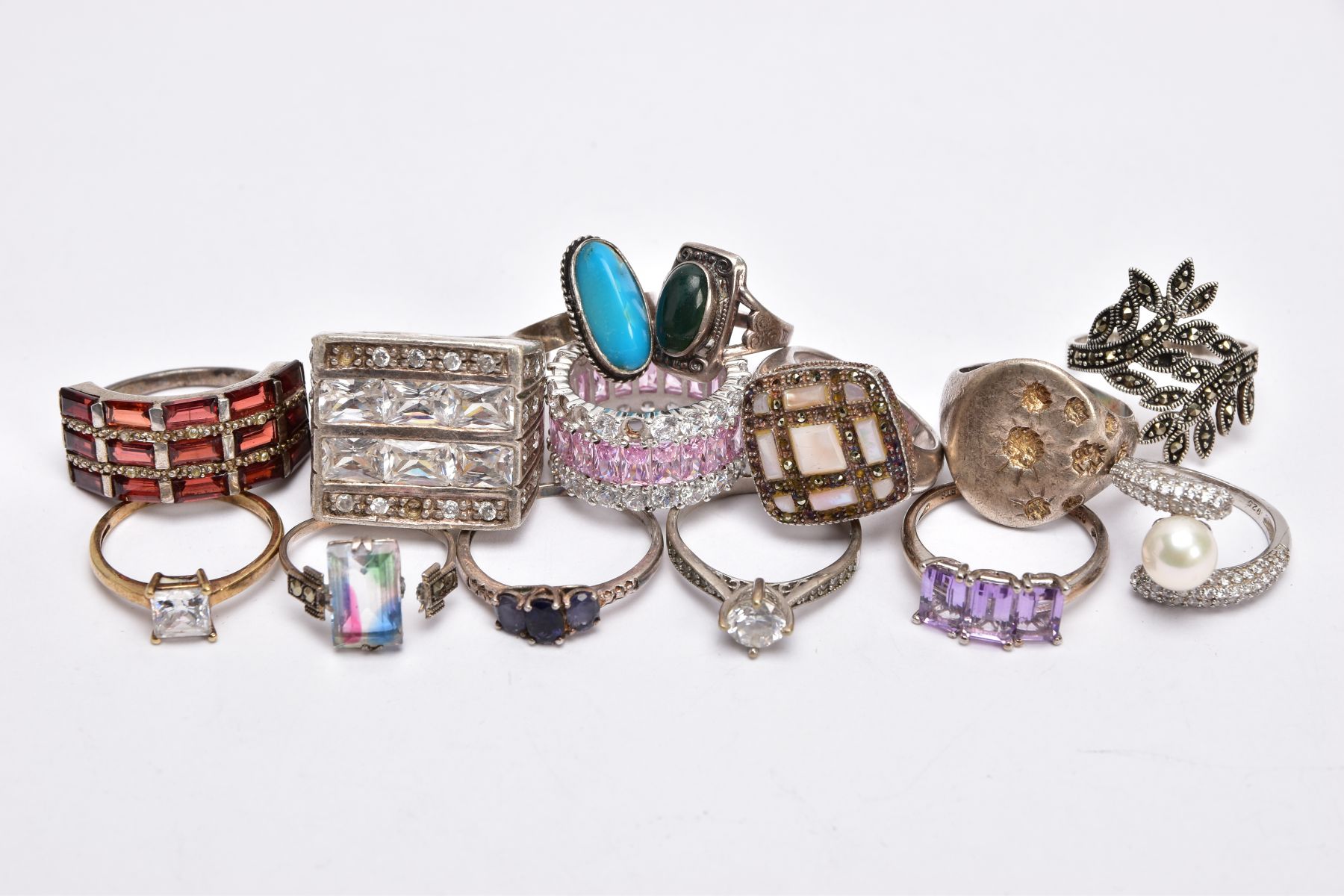 A SELECTION OF SILVER AND WHITE METAL RINGS, to include a foliate marcasite ring, a signet style