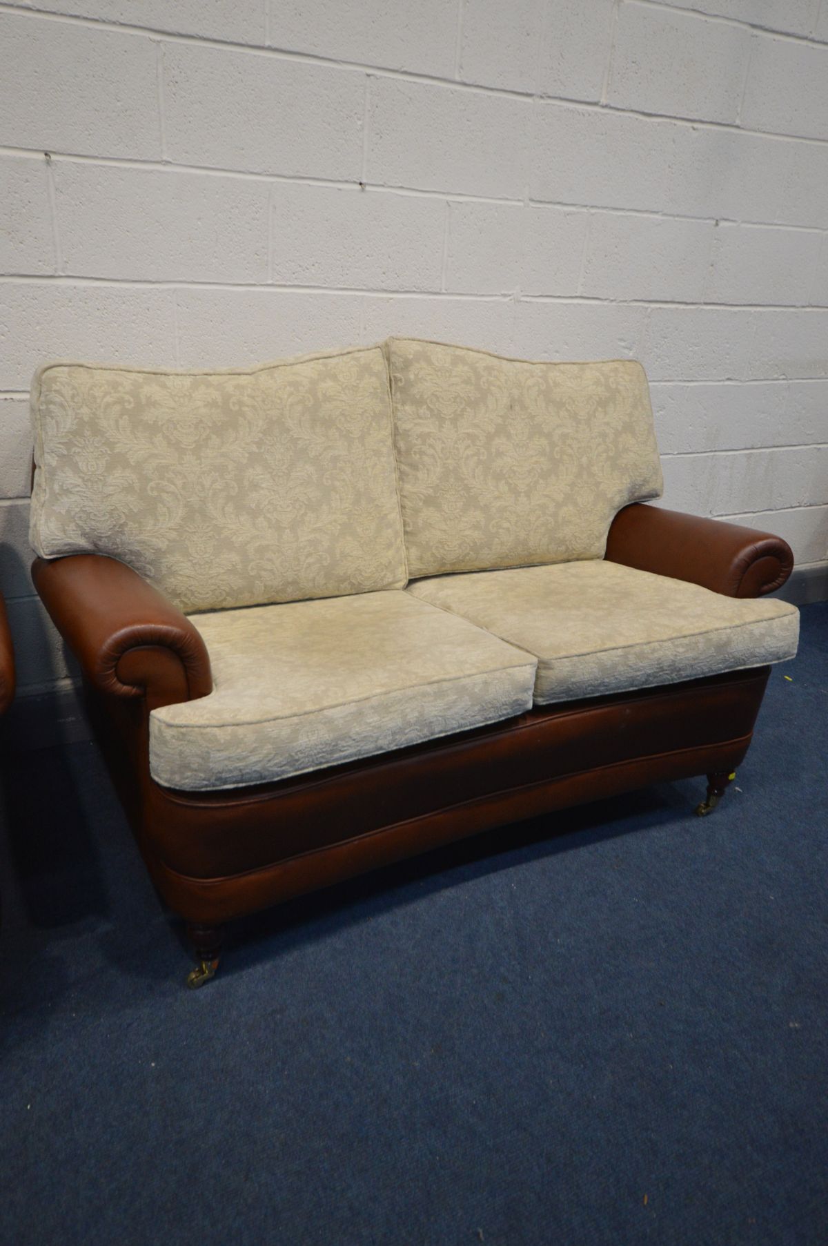 A BROWN LEATHER AND CREAM FABRIC TWO PIECE LOUNGE SUITE, comprising a three seater, length 183cm, - Image 2 of 3