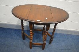 A SMALL OAK BARLEY TWIST OVAL GATE LEG TABLE, open width 90cm x closed width 38cm x depth 62cm x