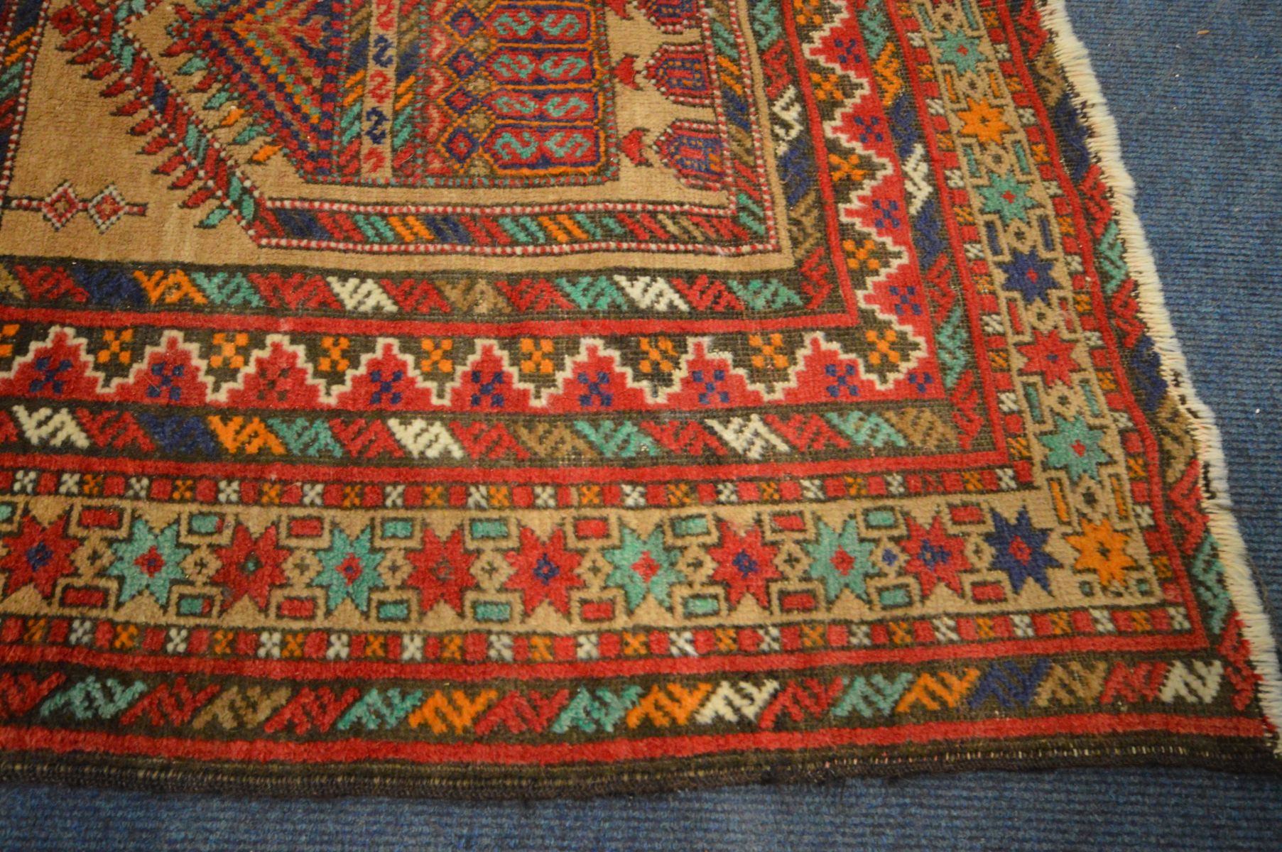 AN INDIAN RUG, russet and red field, and multistap border, 238cm x 128cm - Image 3 of 4