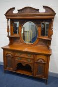 A LARGE EDWARDIAN OAK MIRROR BACK SIDEBOARD, foliate carved decoration, three bevelled edge mirrors,