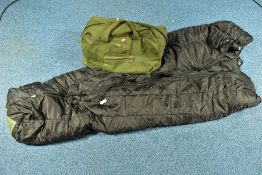 A BLACK MILITARY STYLE MODULAR COLD WEATHER SLEEPING BAG contained in a drab olive Military Grip