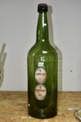 A LARGE GLASS GUINNESS ADVERTISING BOTTLE, with labels 'Extra Stout Guinness, Dublin & London',