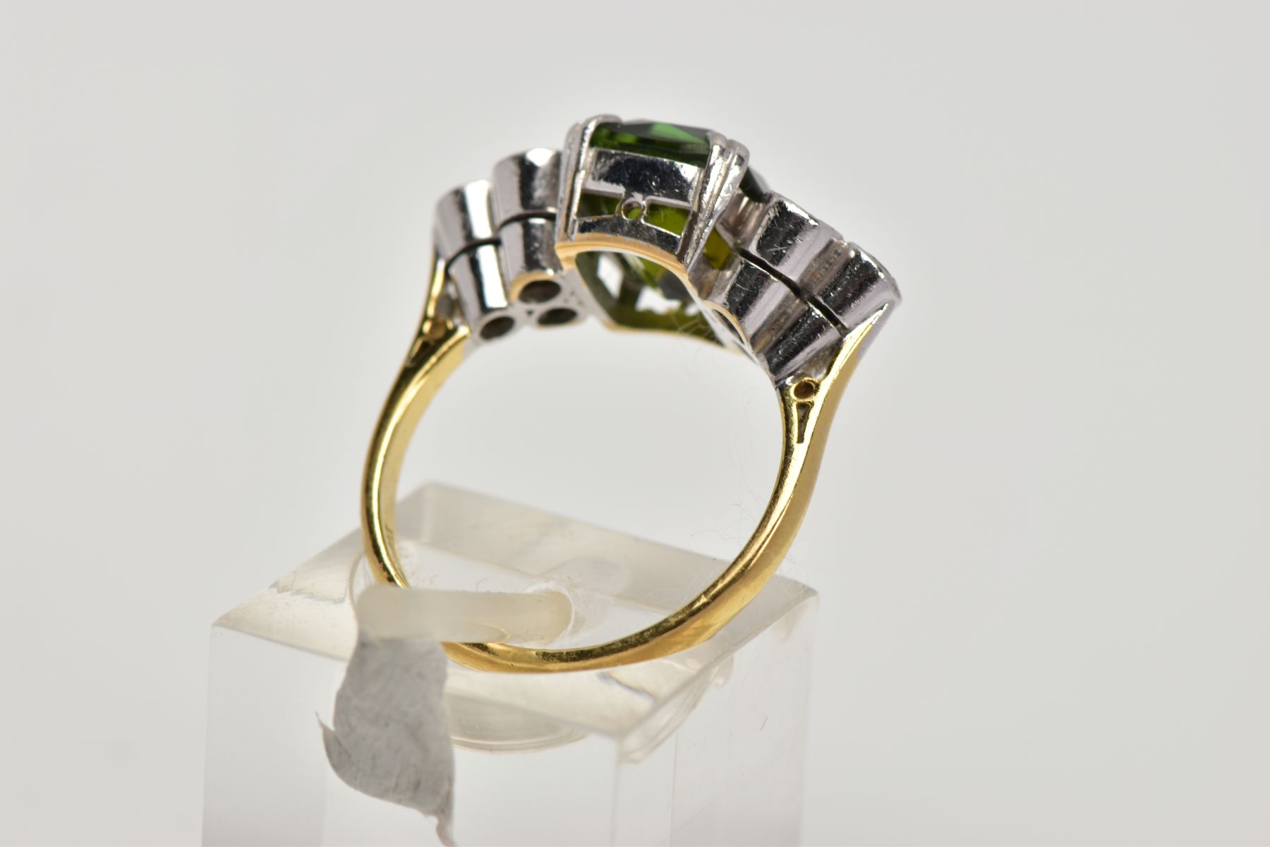 AN 18CT GOLD TOURMALINE AND DIAMOND DRESS RING, centring on an emerald cut green tourmaline, flanked - Image 3 of 4