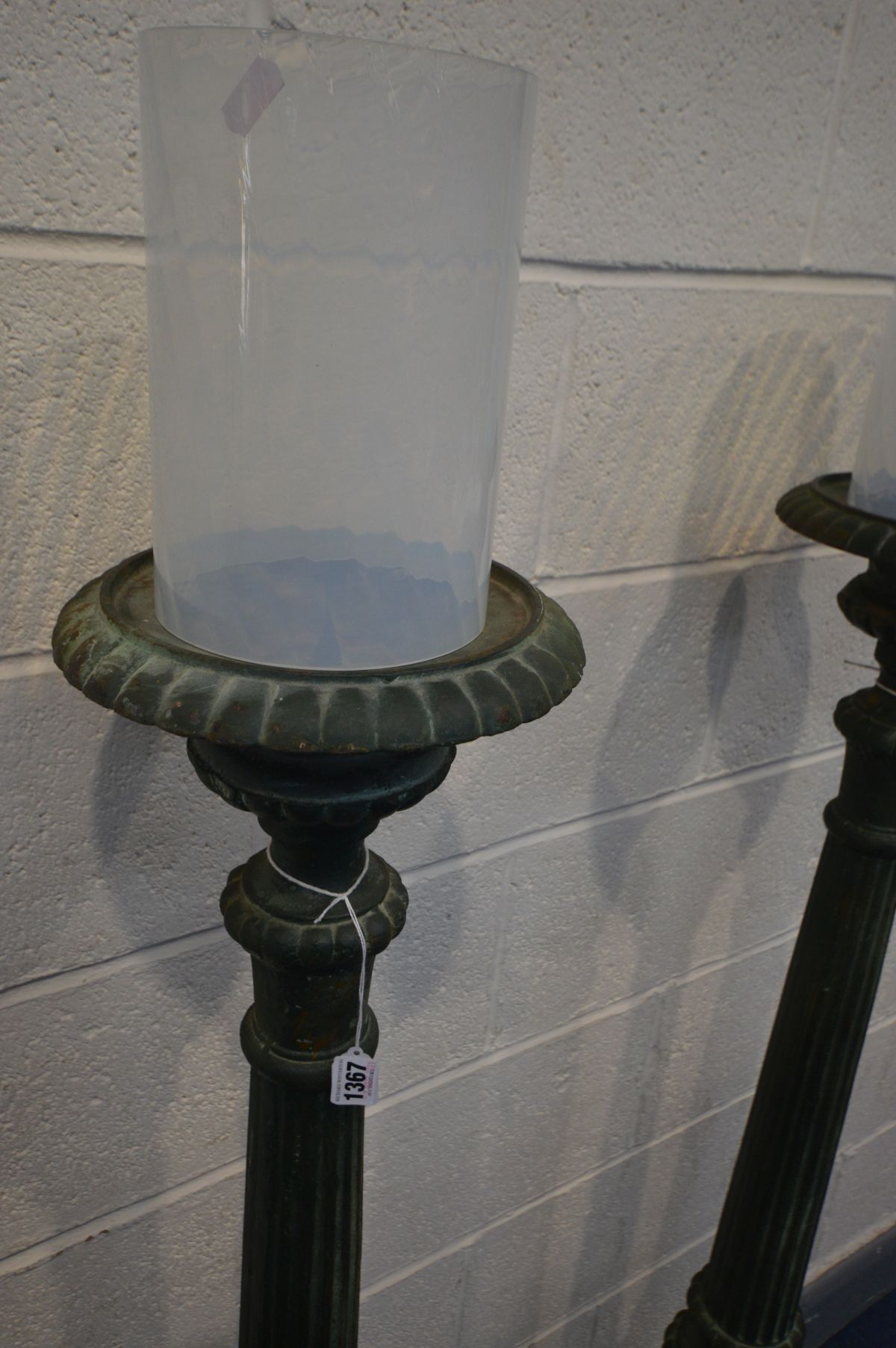 A PAIR OF ORNATE/GOTHIC CAST IRON PRICKET CANDLE STANDS, with later frosted cylindrical glass - Image 2 of 4