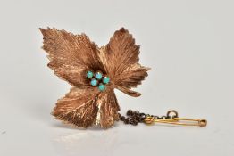 A 9CT GOLD BROOCH, in the form of a textured leaf, to the centre are five small turquoise cabochons,