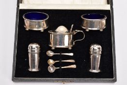 A CASED SILVER FIVE PIECE CONDIMENT SET, comprising of two oval salts, each raised on four ball