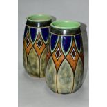 A PAIR OF EARLY 20TH CENTURY ROYAL DOULTON STONEWARE BALUSTER VASES, incised and glazed with