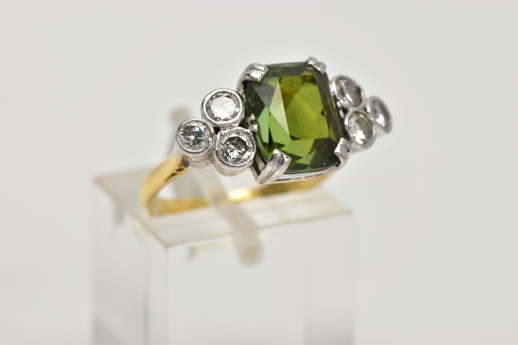 AN 18CT GOLD TOURMALINE AND DIAMOND DRESS RING, centring on an emerald cut green tourmaline, flanked - Image 4 of 4