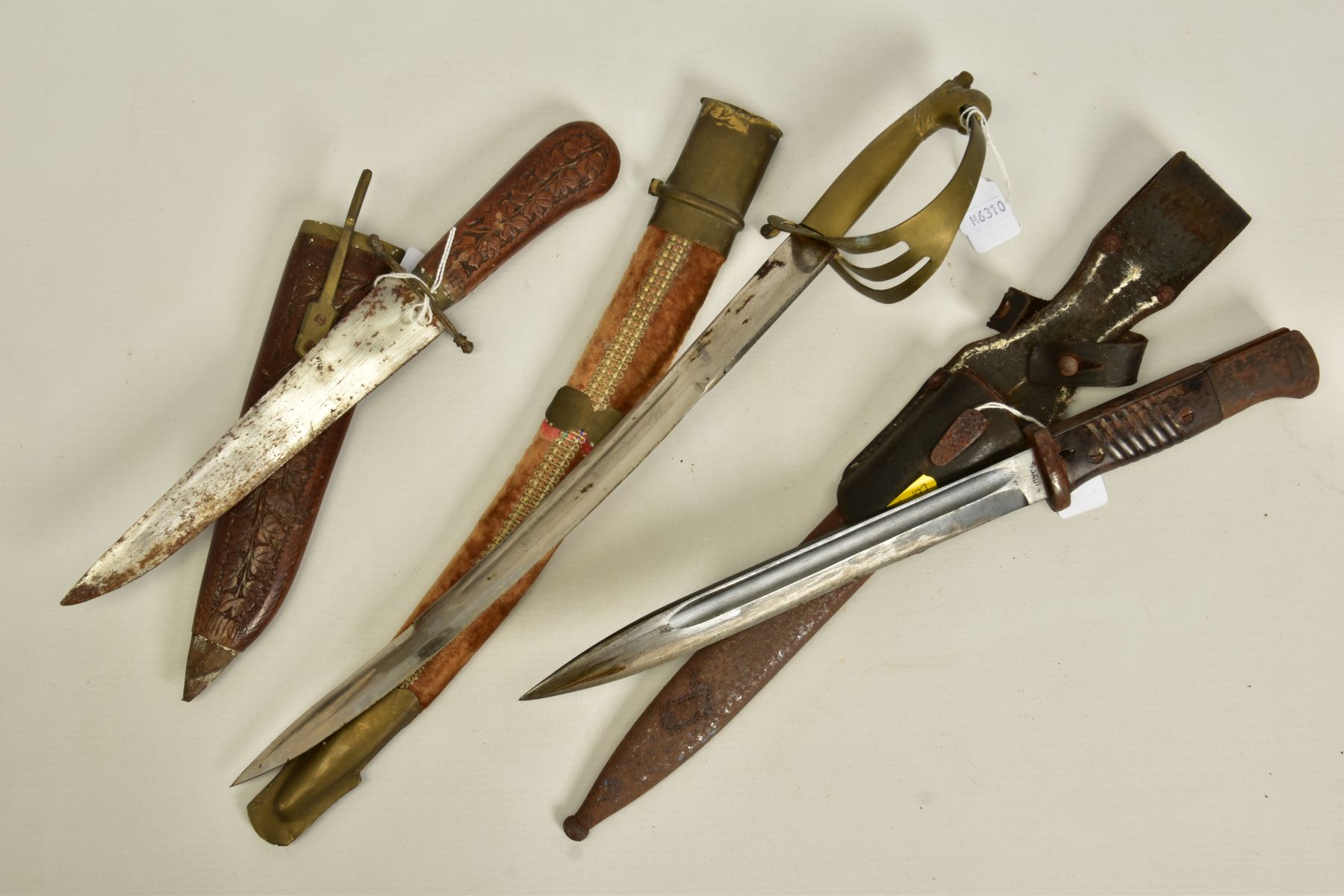 TWO EXAMPLES OF INDIAN SUB-CONTINENT TOURIST PIECE DAGGERS, both marked India, both with scabbards