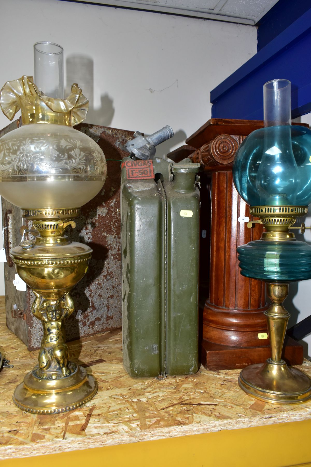 SEVEN ITEMS, comprising a pair of wooden column pedestals, military marked petrol can, two oil