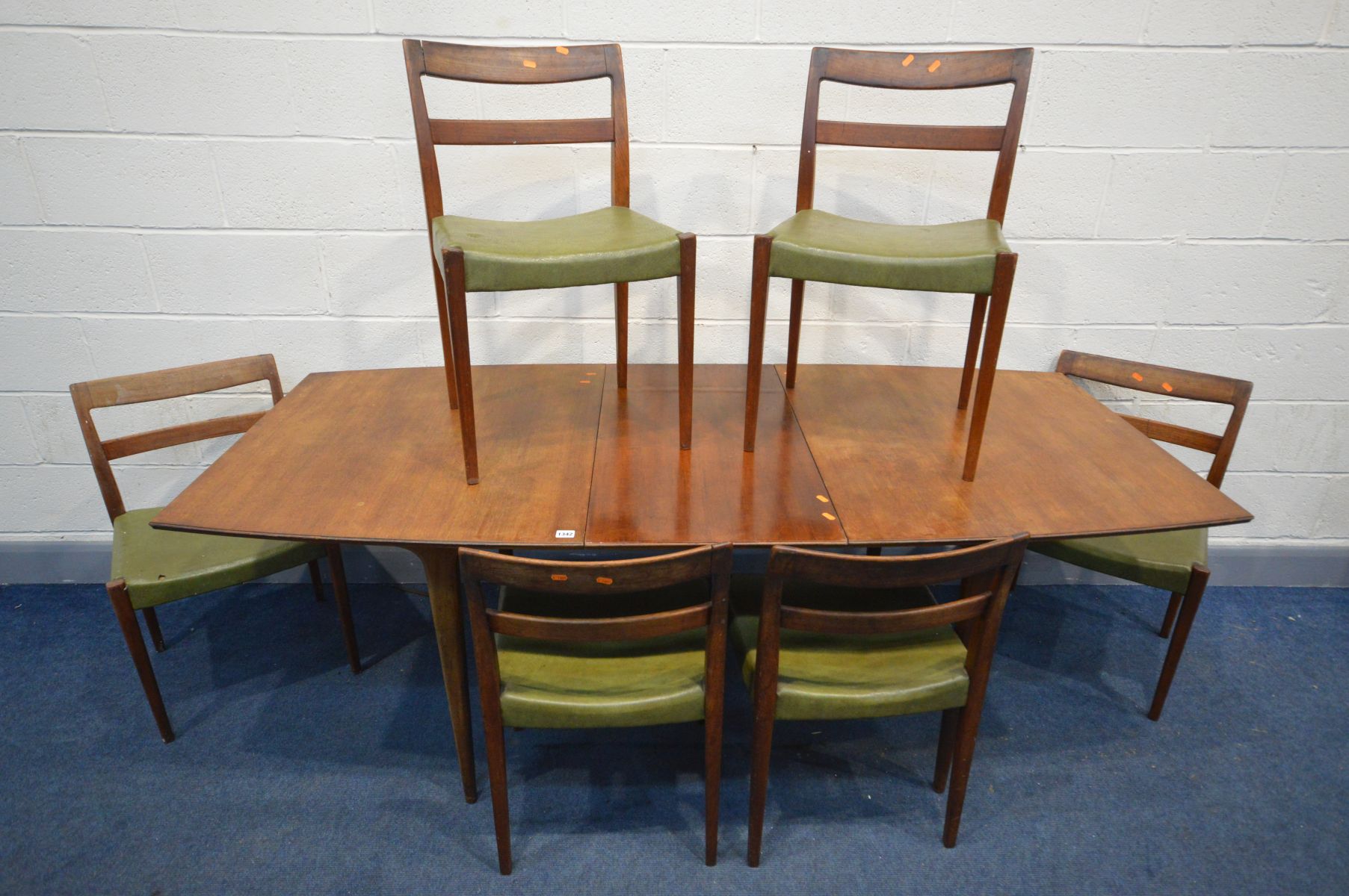 A MCINTOSH AND CO TEAK EXTENDING DINING TABLE, with a single additional leaf, extended length