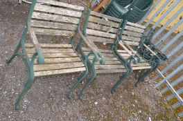 THREE COMPLETE MODERN CAST IRON GARDEN CHAIRS with slatted seat and back 62cm wide, three similar