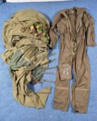 A BOX CONTAINING A MILITARY BIVOUAC TENT with metal pegs, a Military Aviators suit, camo item (