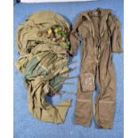 A BOX CONTAINING A MILITARY BIVOUAC TENT with metal pegs, a Military Aviators suit, camo item (