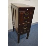 AN EARLY 20TH CENTURY MAHOGANY TWO DRAWER FILING CABINET, raised on square block legs, with a