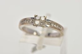 A 9CT WHITE GOLD DIAMOND RING, designed as a central square of four princess cut diamonds with six