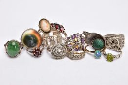 A SELECTION OF THIRTEEN SILVER AND WHITE METAL RINGS, to include an operculum shell ring, a