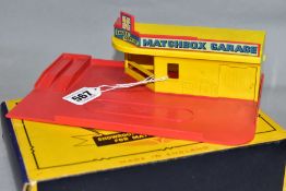 A BOXED MATCHBOX GARAGE SHOWROOM AND SERIVCE STATION, No. MG1, red base and roof sign, yellow