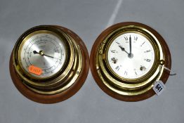 A WEMPE BRASS CASED SHIPS STYLE BAROMETER AND MATCHING WALL CLOCK, both with loose wooden wall