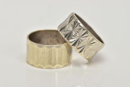 TWO 1960'S 9CT GOLD BAND RINGS, the first with engraved vertical banded design, the second with