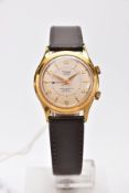 A VINTAGE RADO ALARM WRISTWATCH, the circular head with cream face and gold coloured numbers, batons