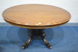 A VICTORIAN WALNUT OVAL LOO TABLE, tilt top, on four scrolled legs, length 135cm x depth 105cm x