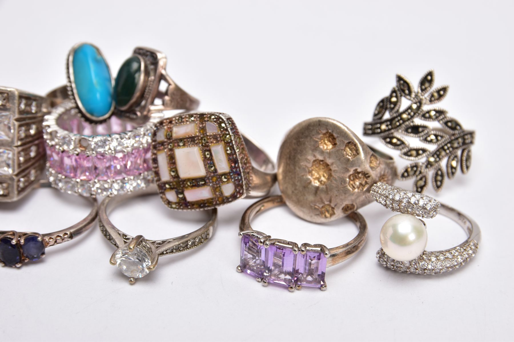 A SELECTION OF SILVER AND WHITE METAL RINGS, to include a foliate marcasite ring, a signet style - Image 3 of 3