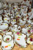 APPROXIMATELY FIFTY PIECES OF ROYAL ALBERT OLD COUNTRY ROSES GIFTWARE, to include vases, (tallest