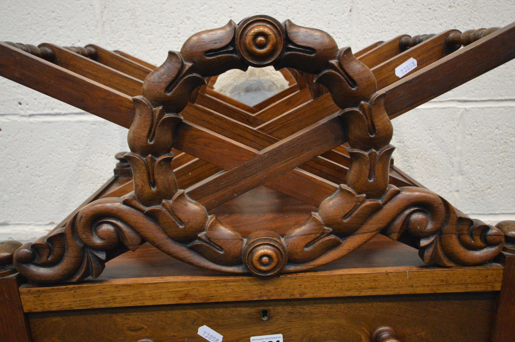 A GEORGE IV ROSEWOOD TRIPLE DIVISION CANTERBURY, the X frame with a carved wreath to the front and - Image 3 of 4