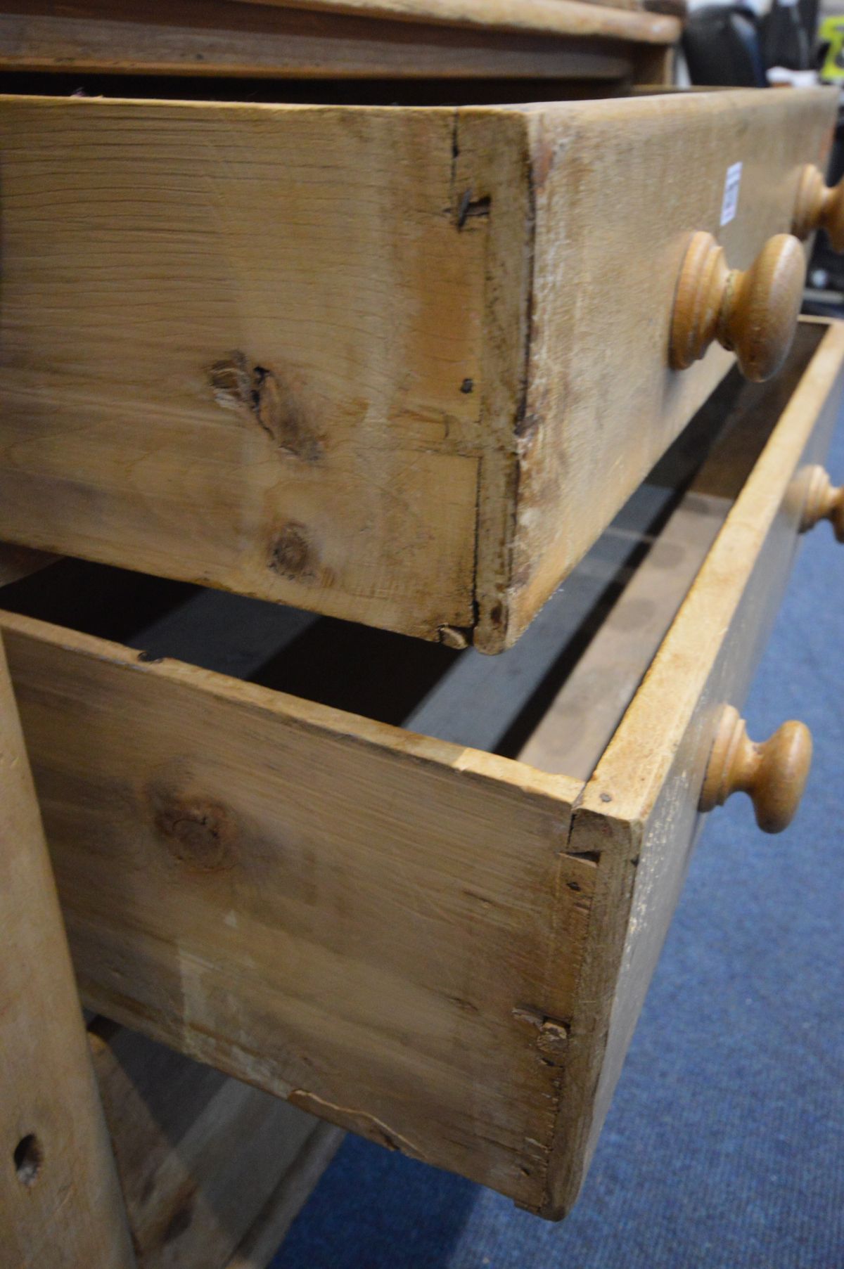 A VICTORIAN PINE SIDEBOARD, with three graduated drawers besides a single panelled cupboard door, on - Image 2 of 4