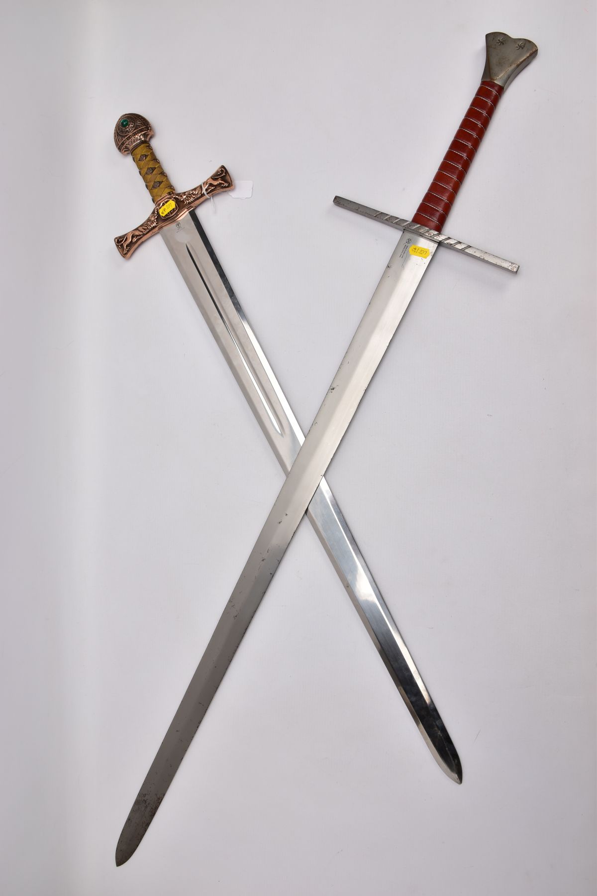 TWO REPLICA COPY SWORDS, a Medieval style sword, with approximately 83cm length blade, slightly