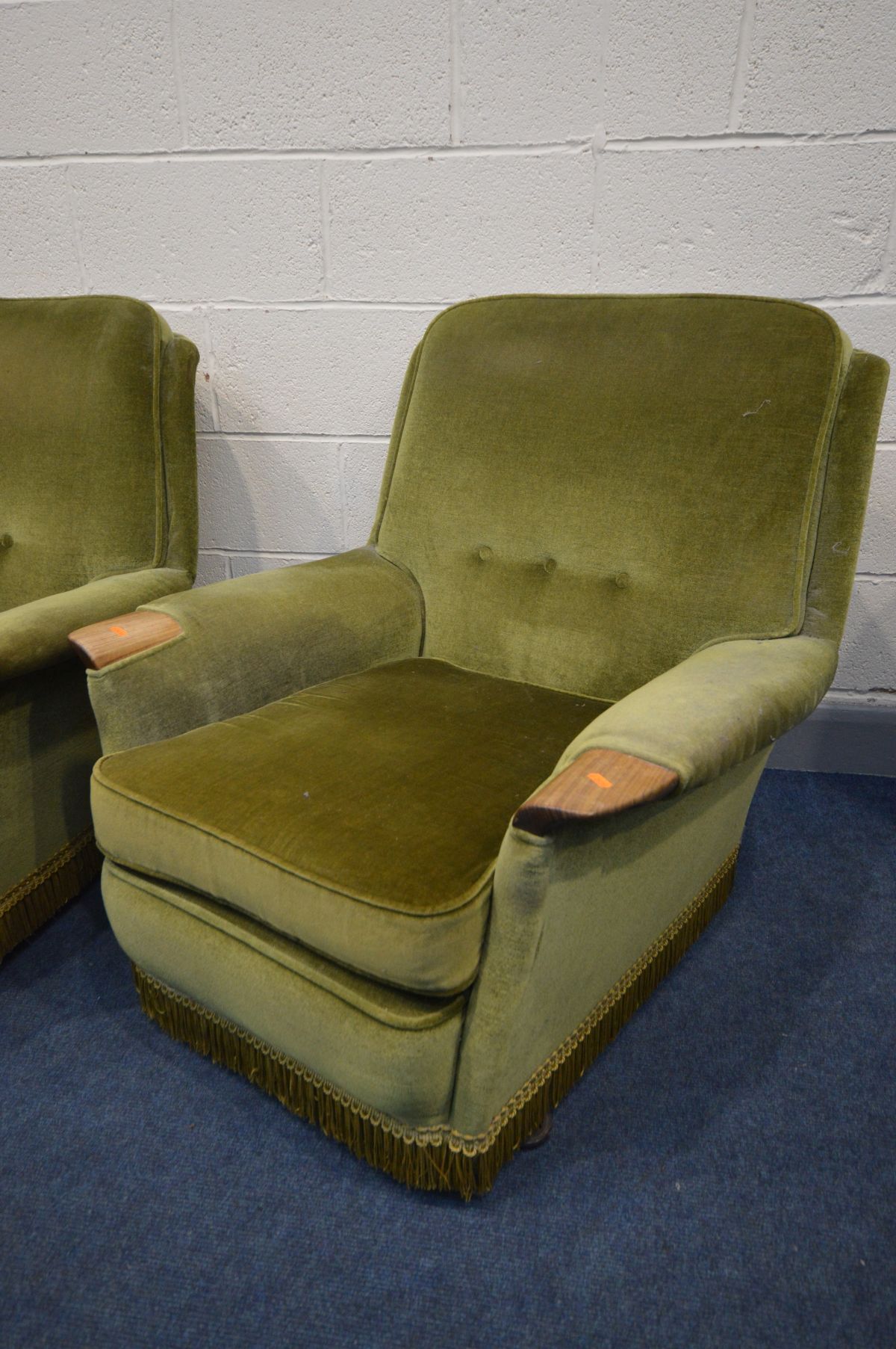 A 1960S GREEN UPHOLSTERED FOUR PIECE LOUNGE SUITE, teak outswept armrests, comprising a settee, - Image 2 of 4