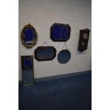 A MID 20TH CENTURY OAK WALL CLOCK (key and pendulum) along with two oak framed wall mirrors with
