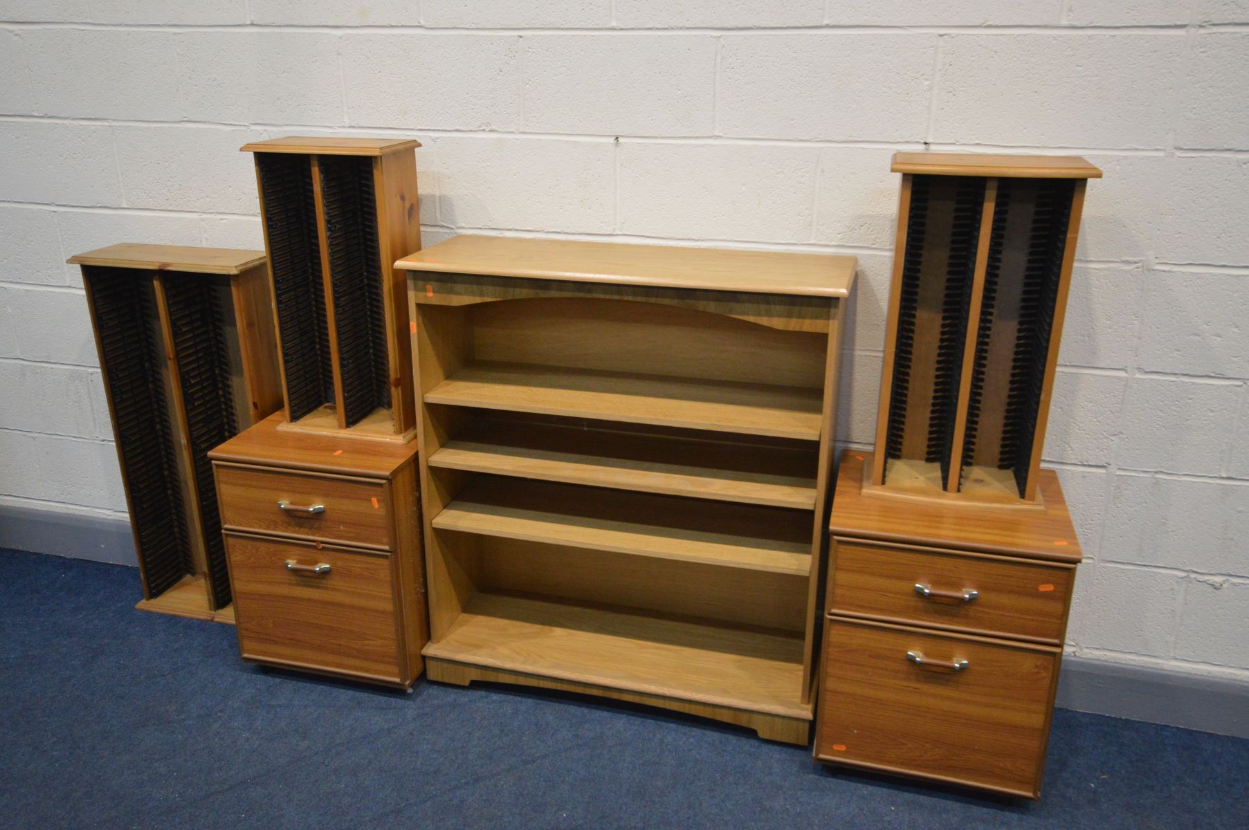 A PAIR OF BEDSIDE CABINETS, along with an oak open bookcase, and three various cd racks (6)