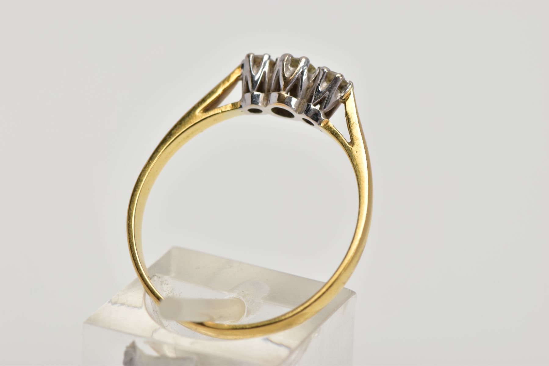 AN 18CT GOLD THREE STONE DIAMOND RING, designed with a row of three graduated round brilliant cut - Image 3 of 4