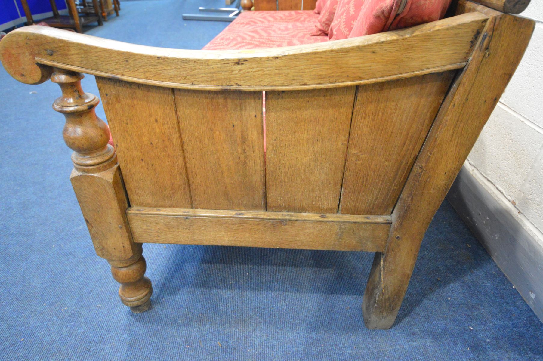 A 19TH CENTURY OAK HALL SETTLE, with panelled sides and back, and scrolled armrests, on turned front - Image 5 of 7