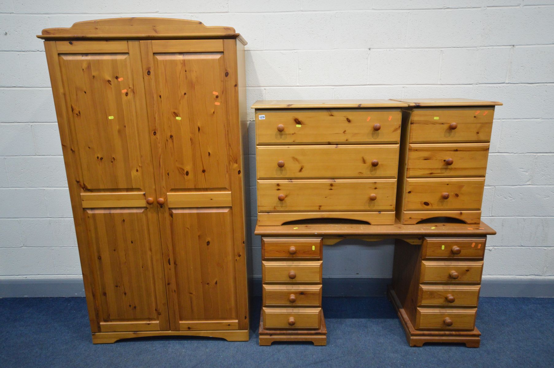 A MATCHED PINE FOUR PIECE BEDROOM SUITE, comprising a double door wardrobe, width 100cm x depth 53cm