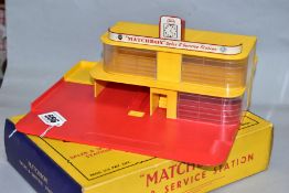 A BOXED MATCHBOX SERIES ESSO SALES & SERVICE STATION, No. MG1, red base and roof sign, yellow ramp