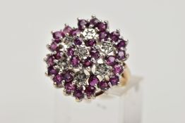 A 9CT GOLD RUBY AND DIAMOND CLUSTER RING, designed as a tiered cluster of single cut diamonds and