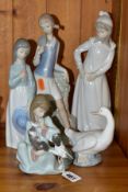 A LLADRO AND FOUR NAO FIGURINES, the Lladro 5640 'Cat Nap', designed by Juan Huerta, issued 1990,