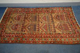 AN INDIAN RUG, russet and red field, and multistap border, 238cm x 128cm