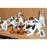 TWELVE ROYAL DOULTON CHARACTER DOGS, comprising HN2586, HN2587 (extensive cracks), HN2554, HN2590,