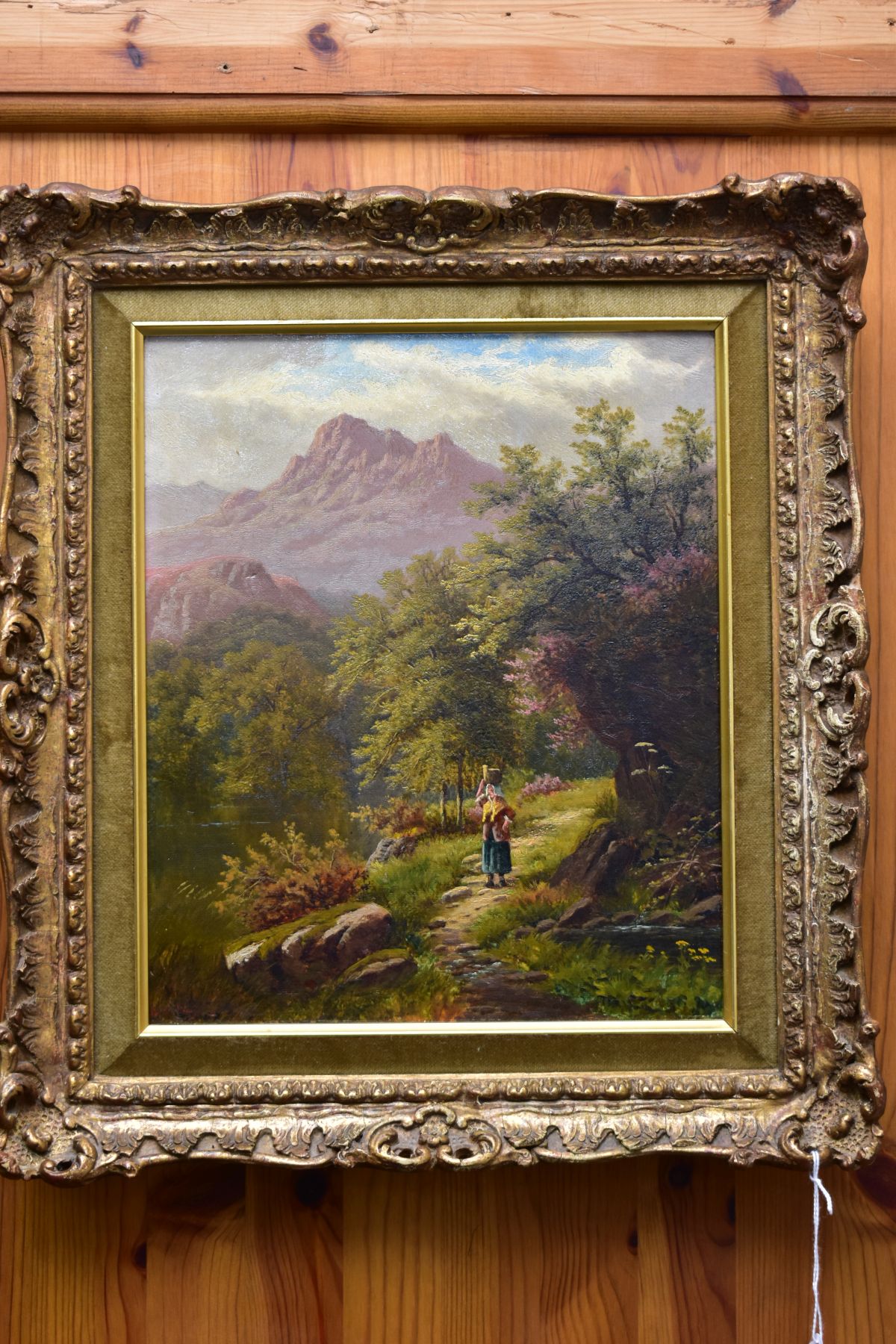 BOLTON KINCAID (19TH/20TH CENTURY) a female figure walking beside water, mountainous background